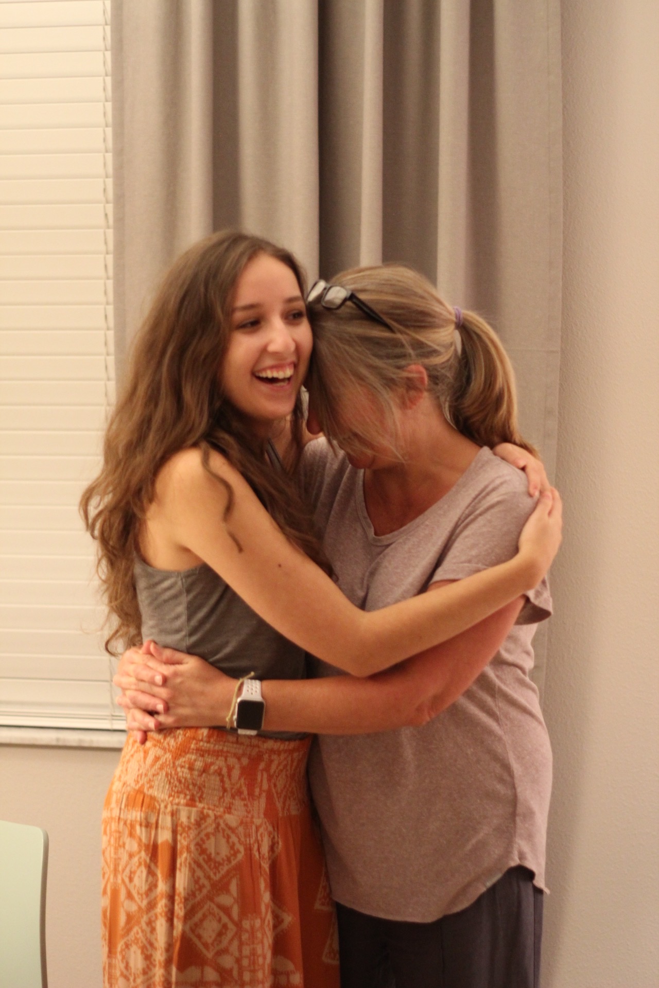 Renee embracing her daughter